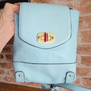Small teal colored backpack purse.